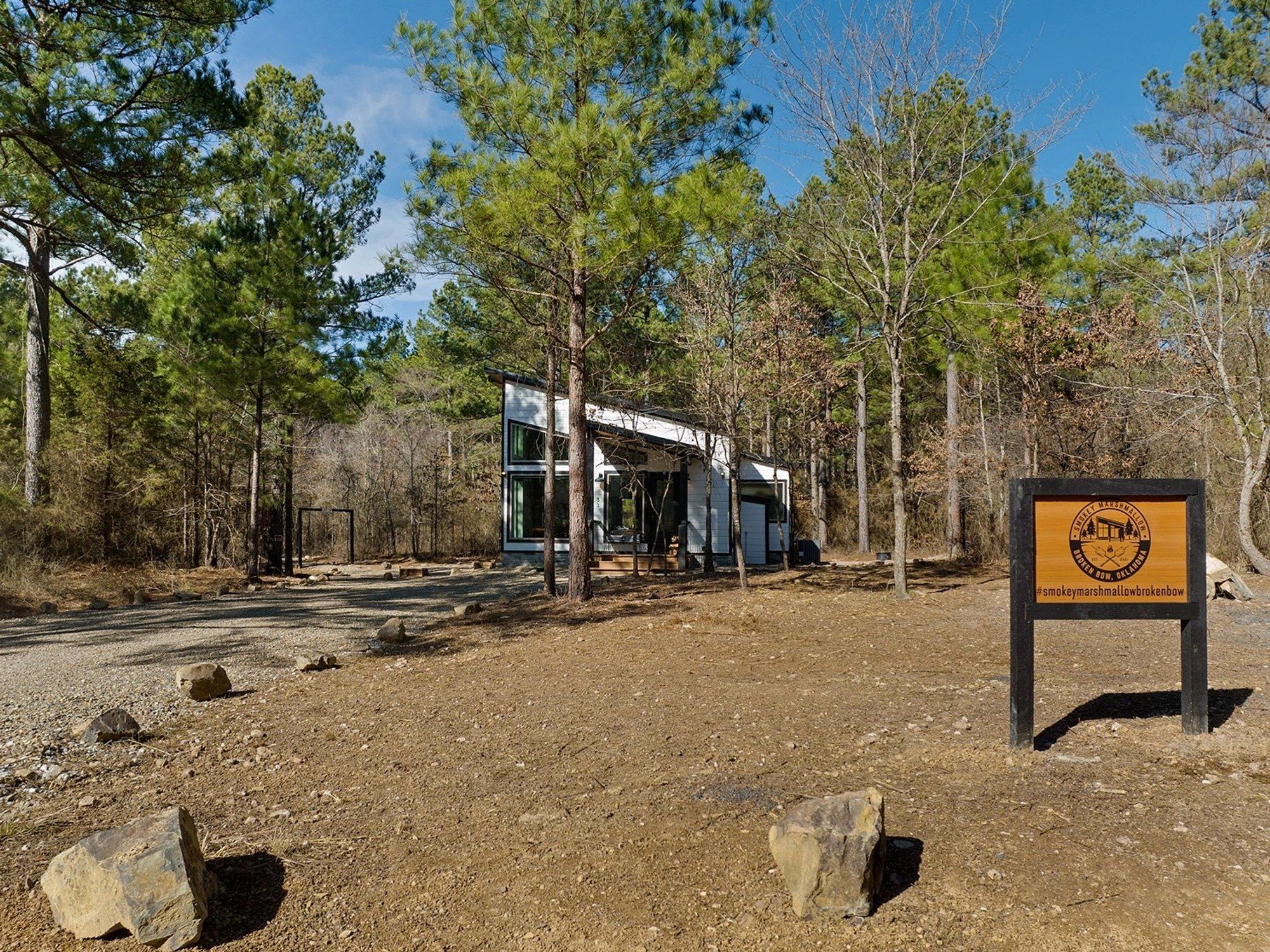 Gravel drive and entrance sign leading to the cabin