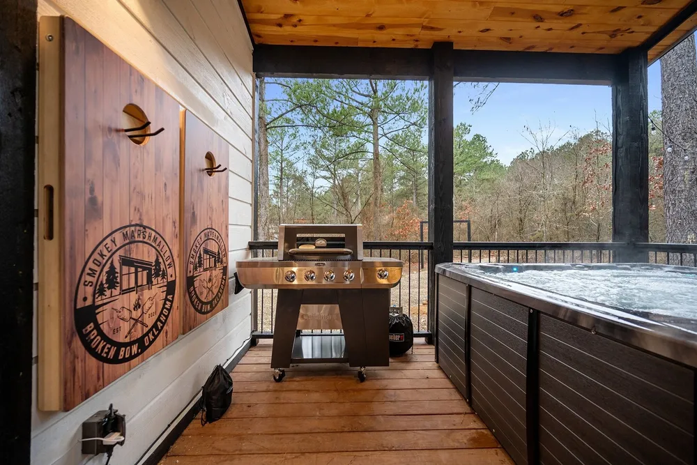 Covered deck with the private hot tub and grill