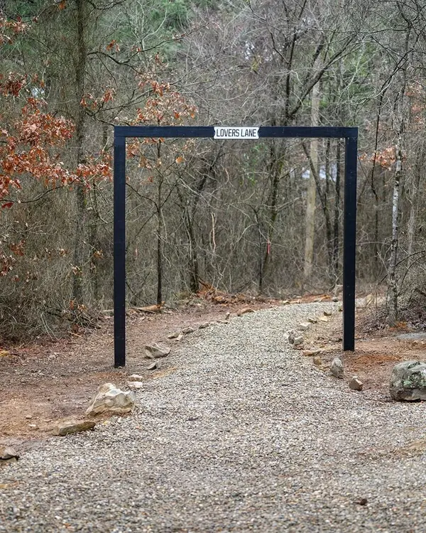 Entrance arch to the Lovers Lane walking trail through the woods