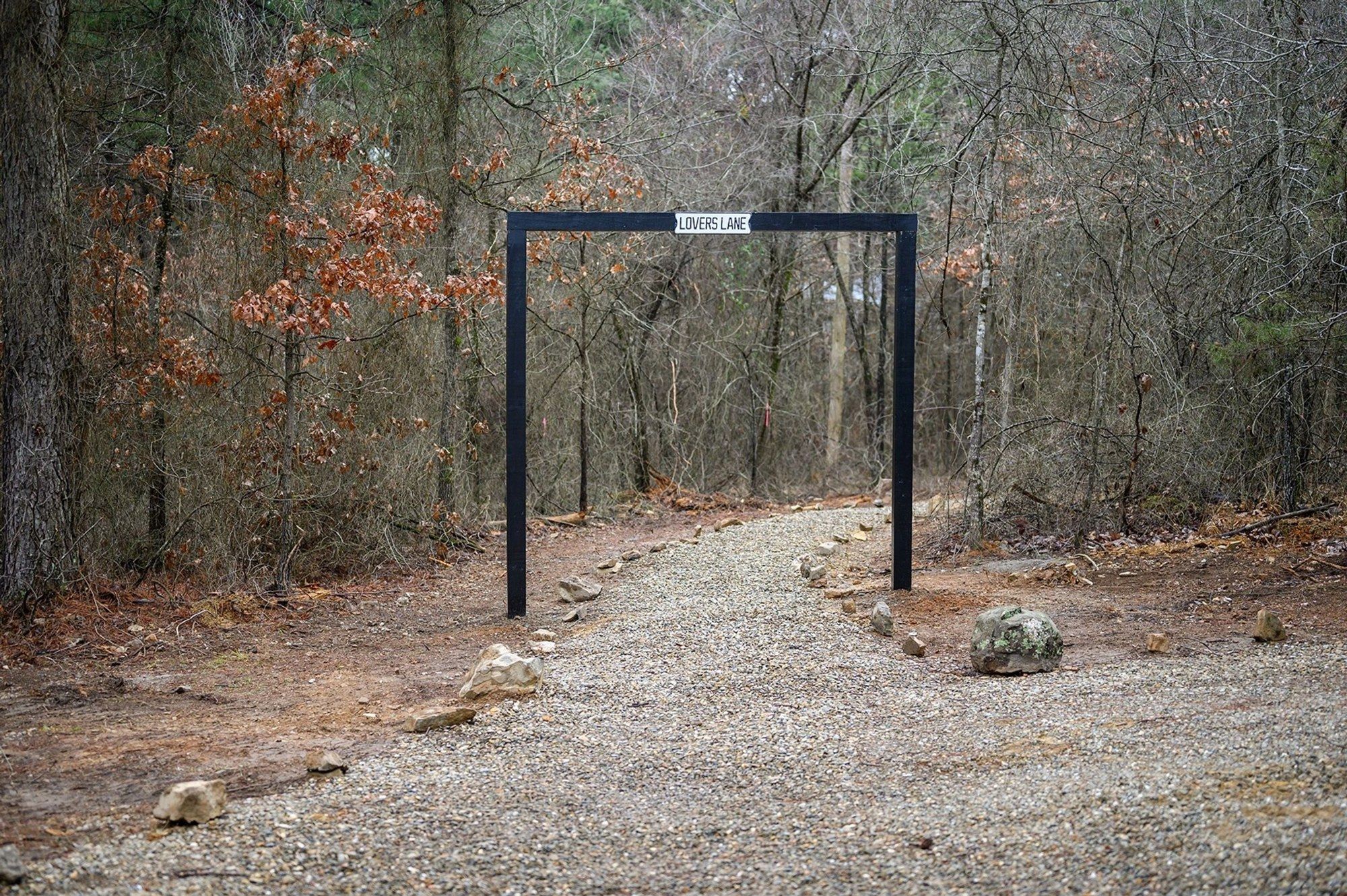 Entrance arch to the Lovers Lane walking trail through the woods
